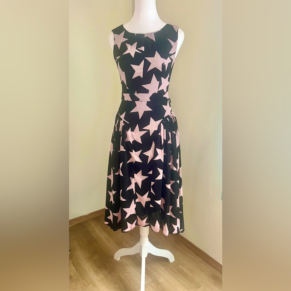 Cute and trendy black dress with pink stars!